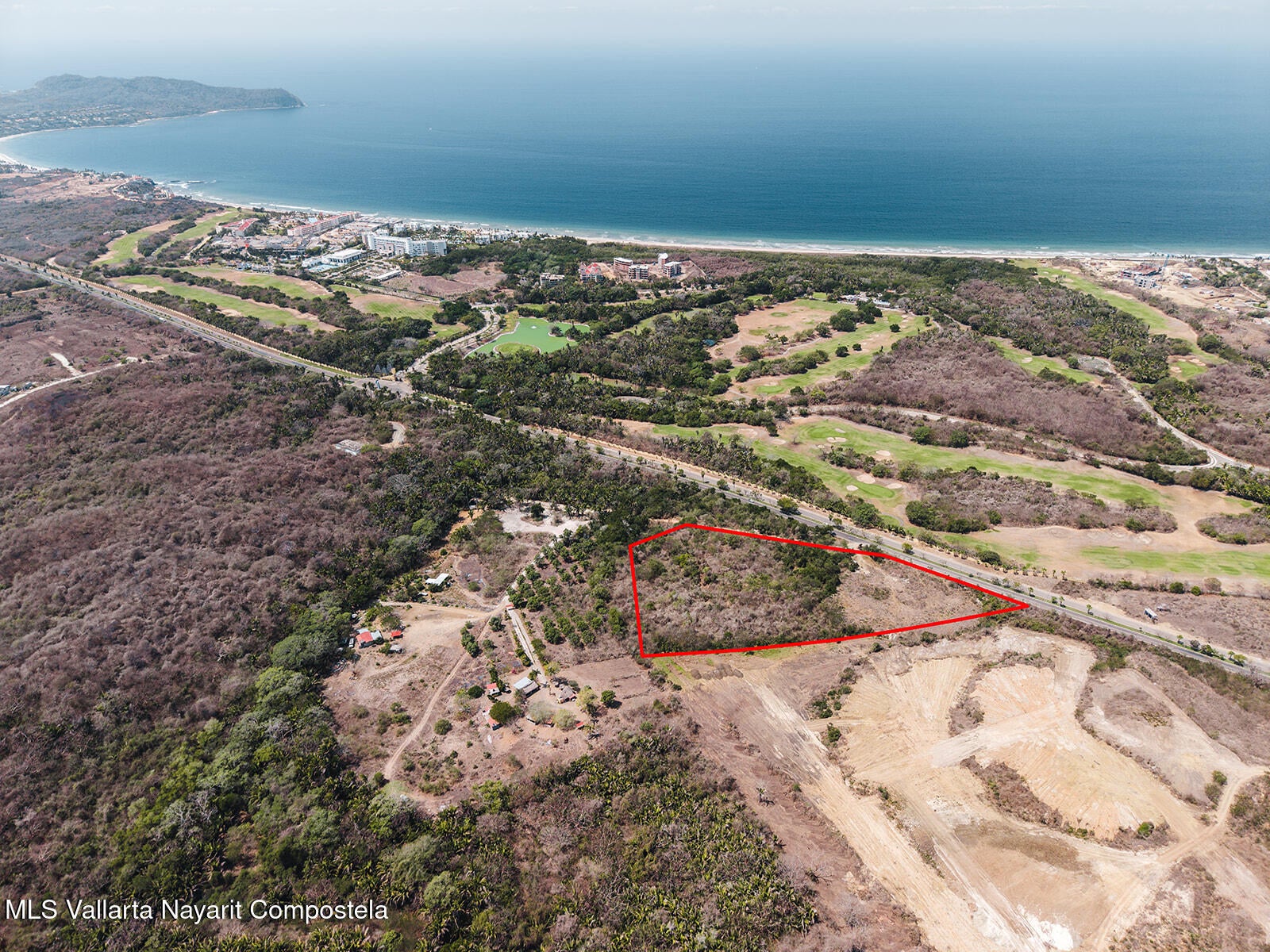 Aerial view of the outlined Lote Ochoa parcel with the Litibú coast beyond